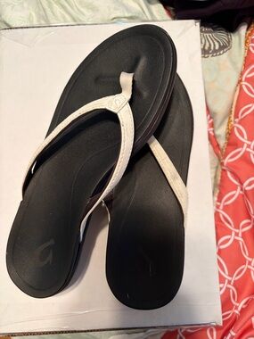 OluKai Black Footbed Flip Flops with White Straps